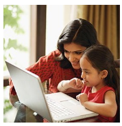Parent and child using a laptop together